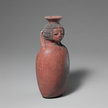 Vase-tête en terre cuite
